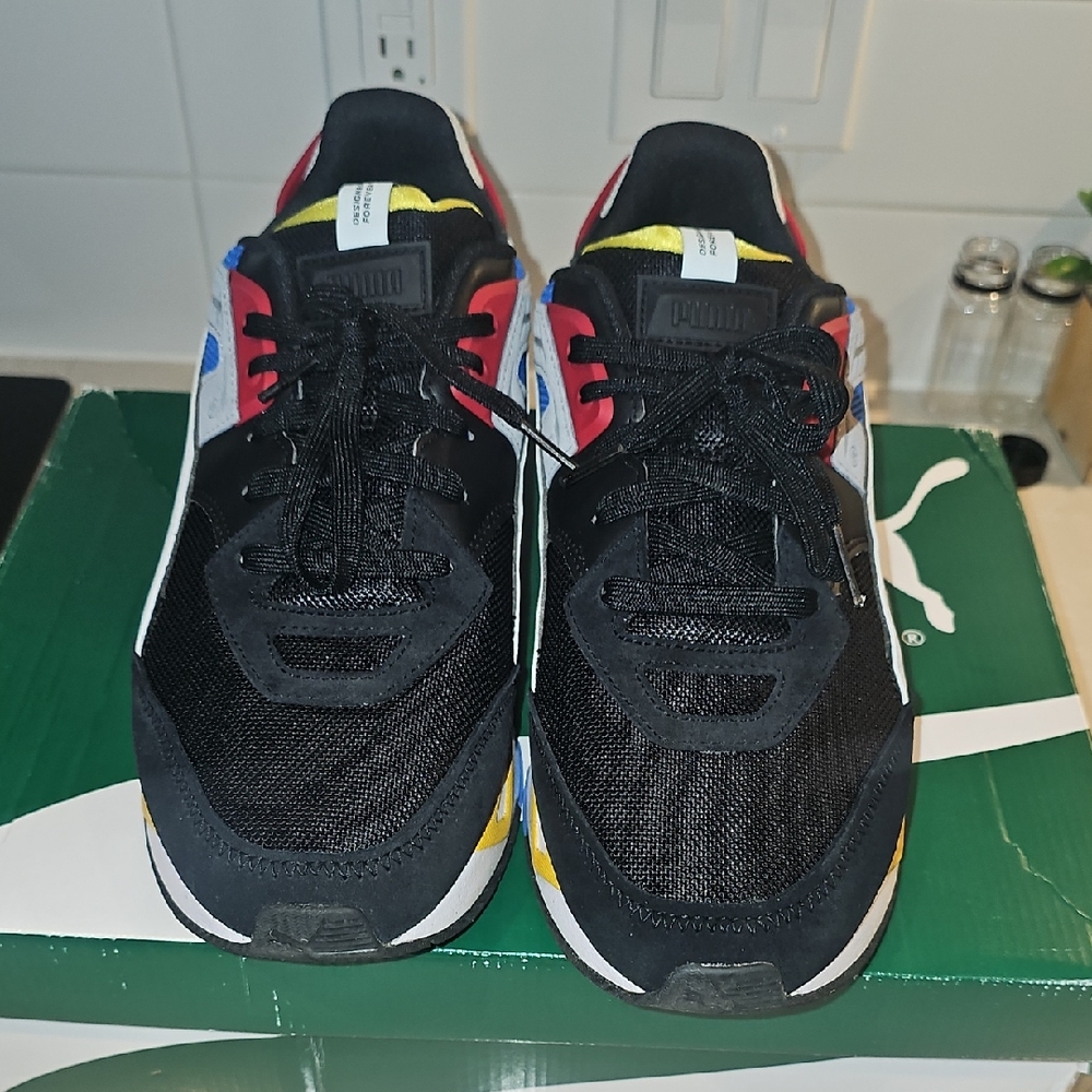 Puma Black and Red Sneakers with Blue and Yellow Accents